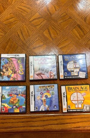 Nintendo 2DS Black + 9 Games - Super Friends, Brain Age, Quest Trio, Cross Word
