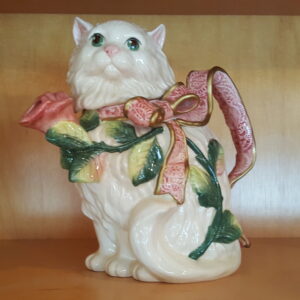 Fitz and Floyd Kittens & Roses ceramic teapot shaped like a Persian cat with pink bow and rose vine accents, handcrafted from the Essentials Collection.