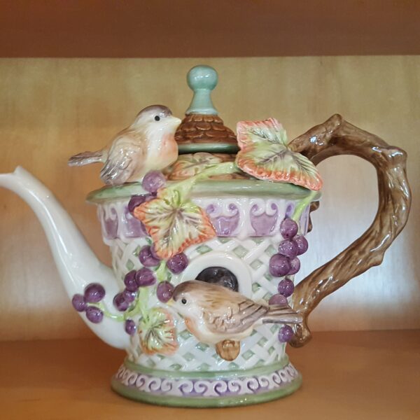 Fitz and Floyd Château Garden teapot featuring a ceramic birdhouse design with birds, grapevine, and a rustic handle, handcrafted in China.
