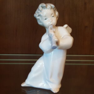 Lladro #4540 “Angel with Flute” porcelain figurine of a cherub playing a flute, urn‑white gloss, approx. 6¼″ tall.