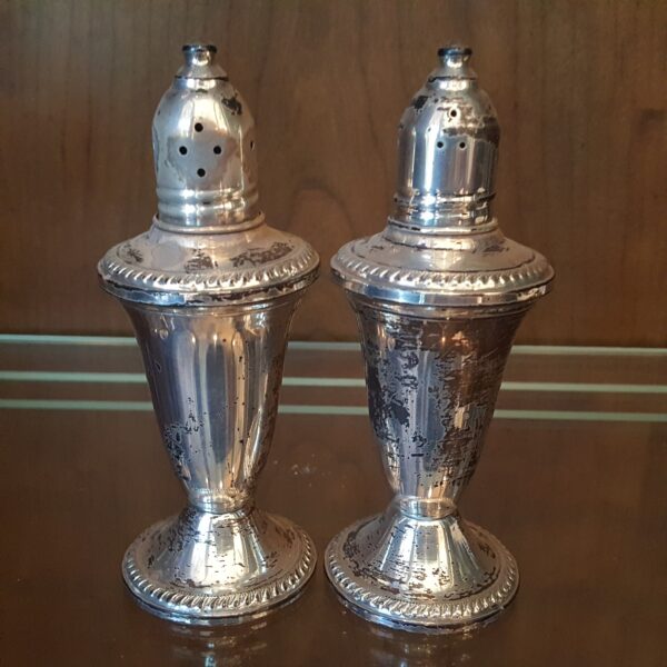 Vintage Duchin sterling silver salt and pepper shakers with beaded rims, weighted bases, and original glass liners