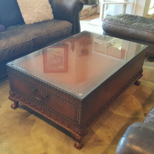 Ralph Lauren rustic coffee table with brass nailhead accents and glass top